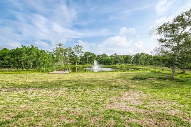 View of pond with fountain. | Image 25