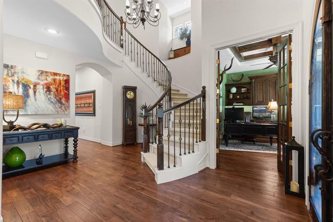 The spiral staircase is a lovely focal point. It also makes a great spot for a Christmas tree! | Image 13