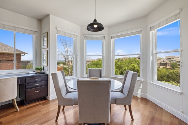 Sunroom / solarium with wood finished floors and plenty of natural light | Image 5