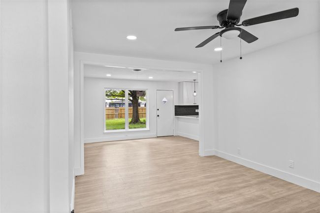 Unfurnished living room featuring recessed lighting, light wood-style floors, baseboards, and a ceiling fan | Image 6