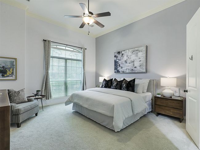 Bedroom with carpet, crown molding, and a ceiling fan | Image 19