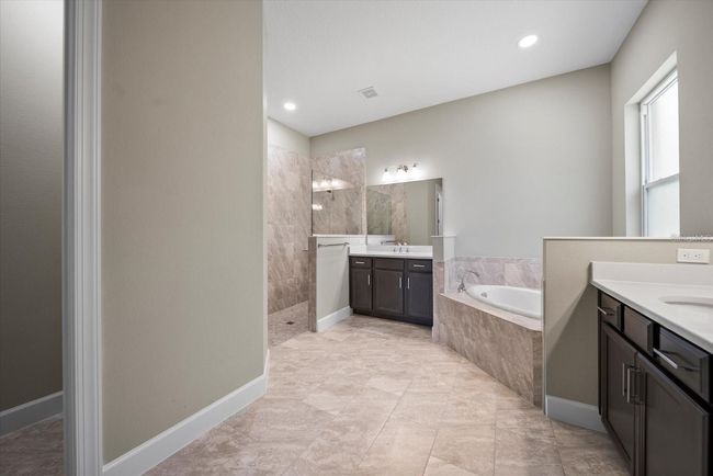 Master ensuite bathroom with split vanities | Image 25