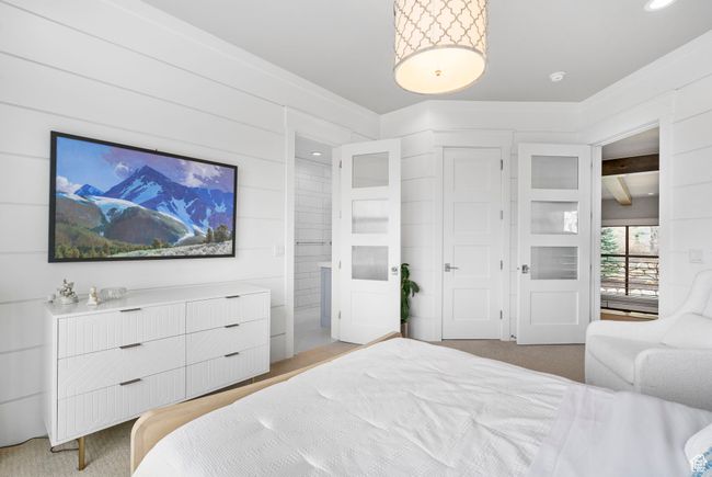 Bedroom featuring a closet and light carpet | Image 46