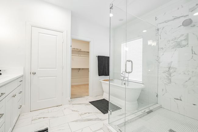Full bathroom with marble finish floor and a glass shower | Image 23