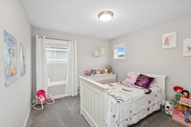 One of three additional secondary bedrooms on the upper level. | Image 15
