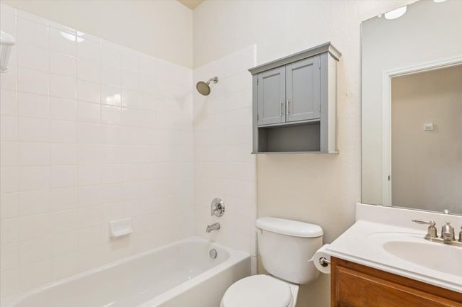 Bathroom featuring vanity and bathtub / shower combination | Image 28