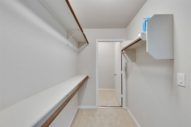 Walk in closet for the second master with an extra space for storage. | Image 16