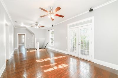 Bonus room with french doors, ceiling fan, and wood-type flooring | Image 3