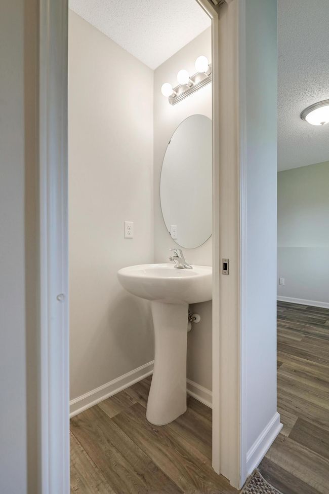 A convenient half bath on the lower level offers added functionality, perfect for guests and everyday use. | Image 31