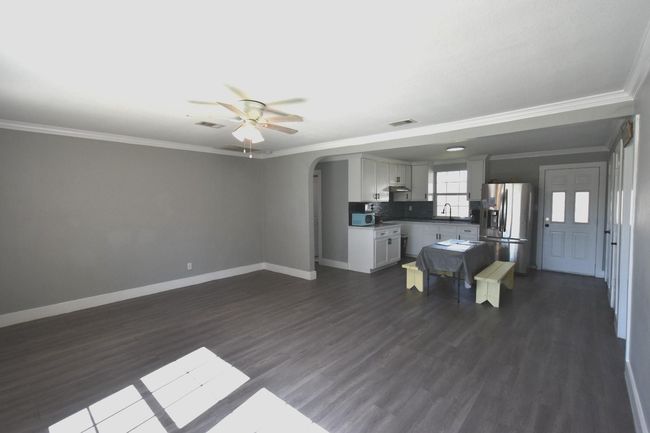 Expansive open-concept living and dining area. | Image 8