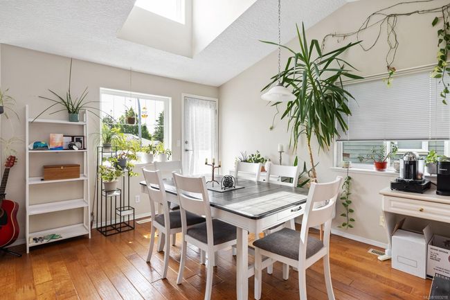 UP STAIRS ON MAIN FLOOR 9'X12'6 DINING ROOM DOOR TO EAST FACING 10'X2'6 BALCONY LARGE SKY LIGHT HARDWOOD FLOORING | Image 12