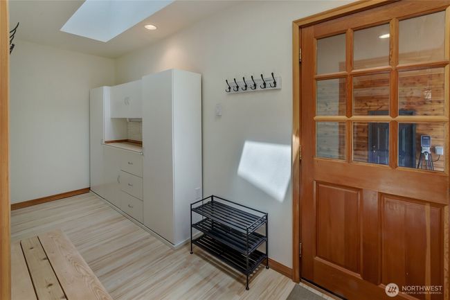 Mud room with updated flooring located off of the breezeway. This could be converted to a future laundry room. | Image 14