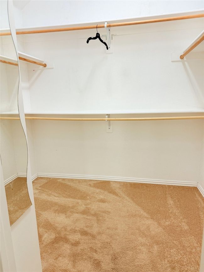 Spacious closet with carpet flooring | Image 8