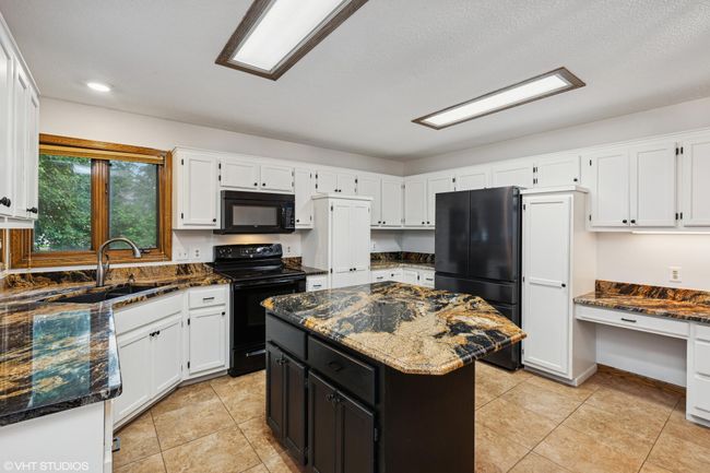 Spacious center island—perfect for prep, snacks, or gathering around | Image 14