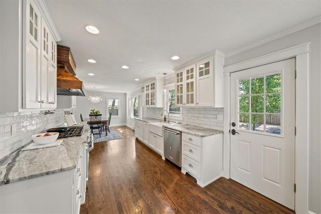 Kitchen with white cabinetry, recessed lighting, appliances with stainless steel finishes, and plenty of natural light | Image 10
