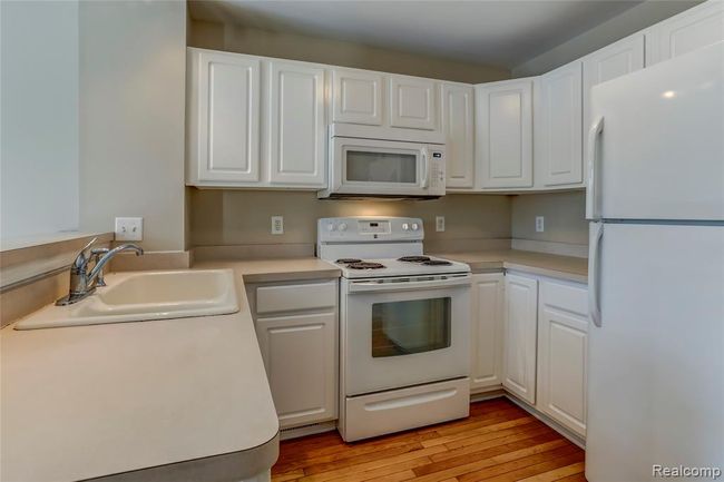 Great kitchen with white cabinets and all appliances included. | Image 8