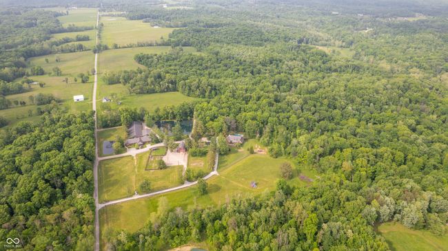 aerial view of property's location featuring a forest | Image 36