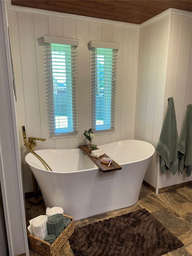 Bathroom with a freestanding bath and wooden ceiling | Image 22