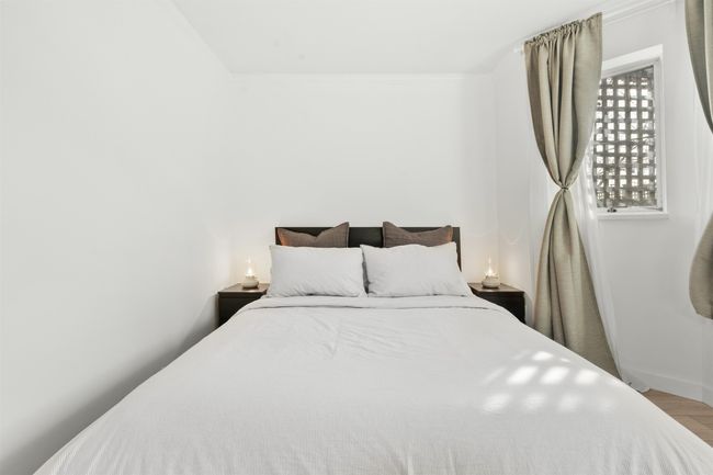 Bedroom featuring baseboards and wood finished floors | Image 17