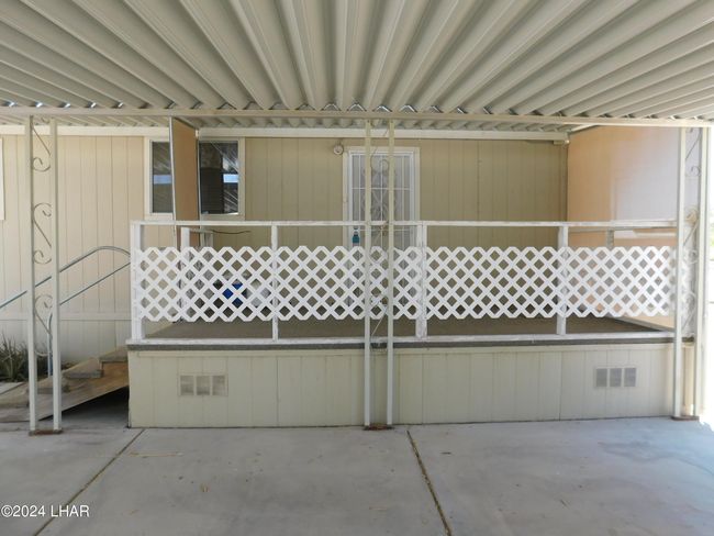 Entering back door of manufactured home. | Image 9