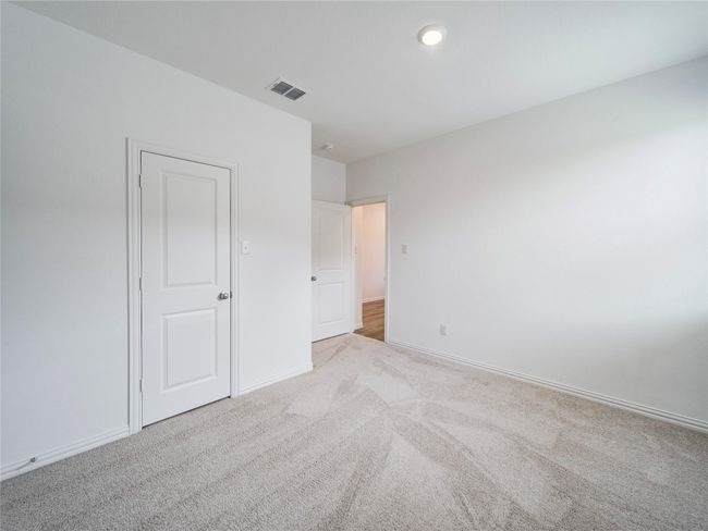 Unfurnished bedroom featuring carpet and baseboards | Image 35