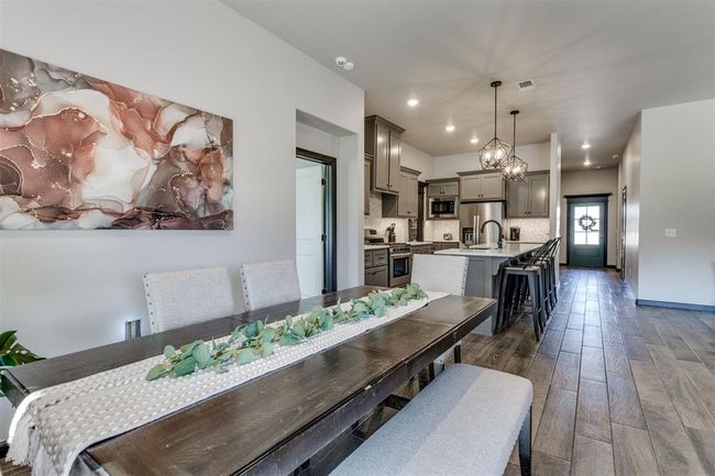 Dining room featuring visible vents, dark wood-style floors, an inviting chandelier, and recessed lighting | Image 27