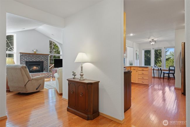 Main entrance opens up to living room, kitchen to the right and first bedroom to the left. | Image 7