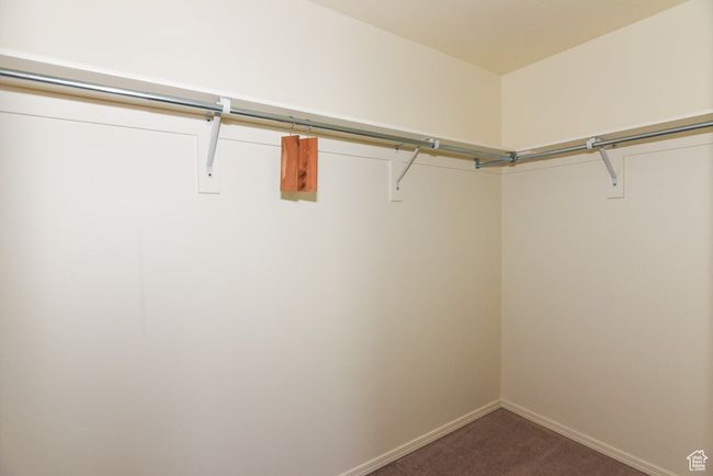Walk in closet featuring carpet floors | Image 21