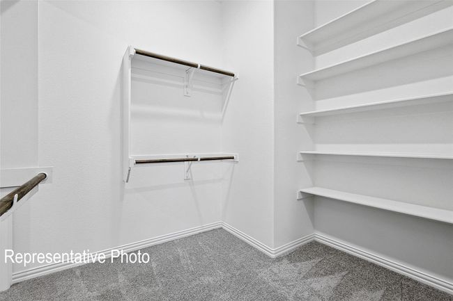 Walk in closet featuring carpet flooring | Image 14