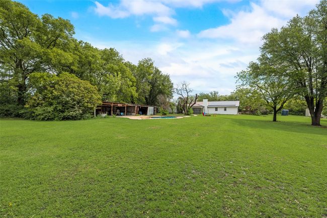 View of yard with an outdoor pool | Image 5