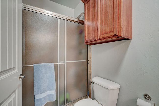 Full bathroom with a shower stall and toilet | Image 37