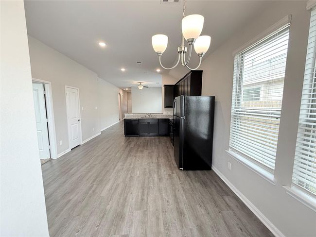 14501 SUGAR PINES DR - Eating area in Kitchen with all black appliances, refrigerator included | Image 18