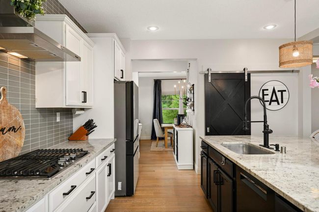 The large pantry is behind the barn door. Refrigerator and dishwasher are brand new! | Image 20