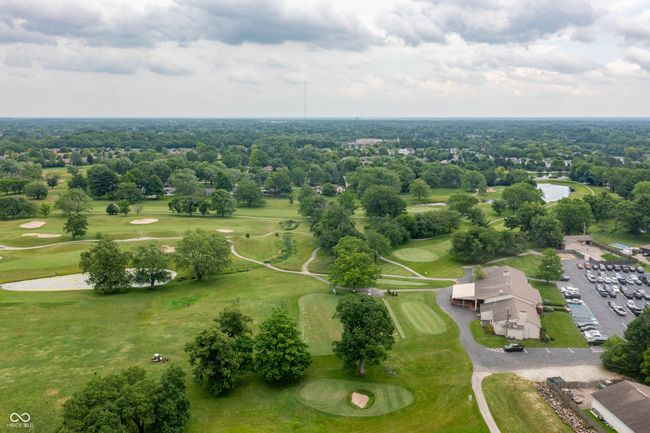 aerial view of a golf club and a large body of water | Image 38