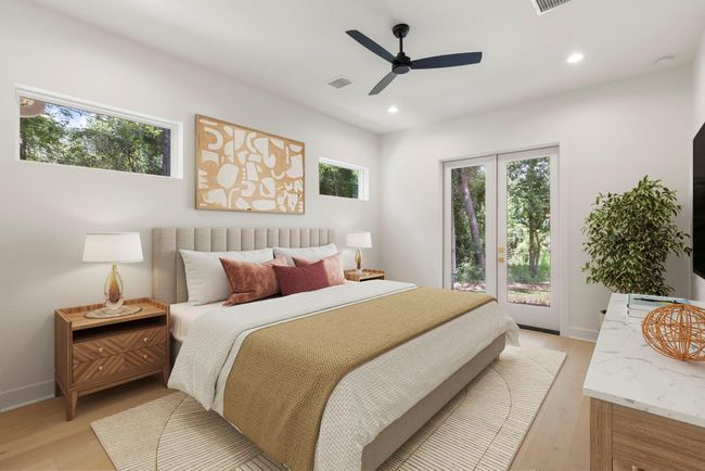 The primary suite is the perfect place to relax after a long day with a private patio, ensuite bath, and tons of closet space. | Image 13
