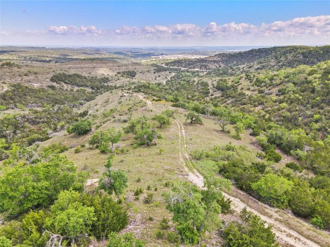 Preservation Ranch is a unique community with only thirty-two individual ranchettes spread over 1, 000 +/- acres of private, high-fenced hill country land. | Image 6