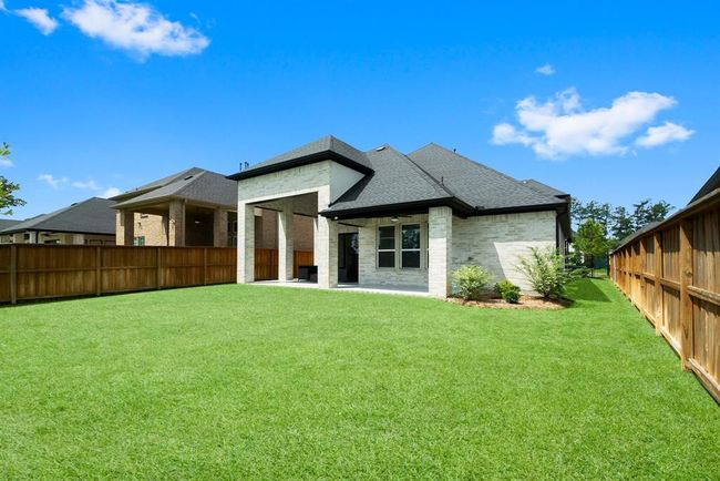 Two-tiered patio with endless outdoor living opportunities. | Image 29