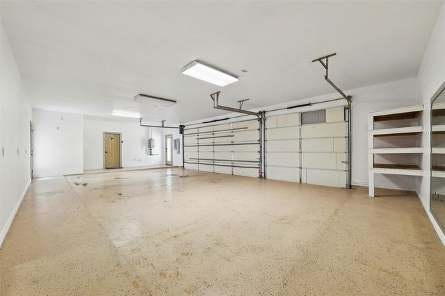 Garage featuring baseboards | Image 24
