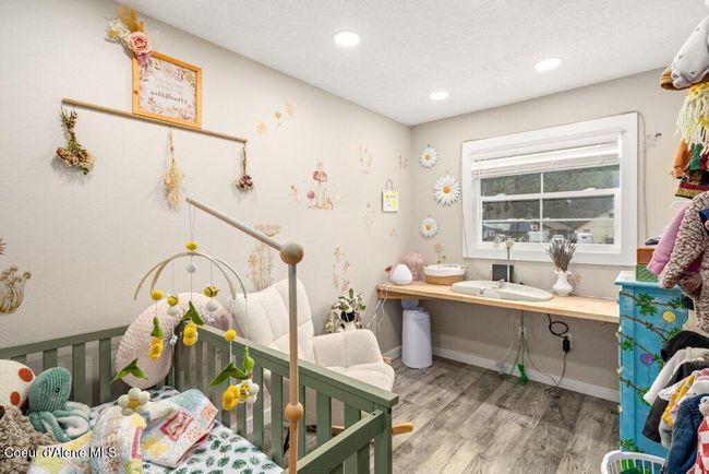 A second bedroom with built-in shelving for convenience | Image 20