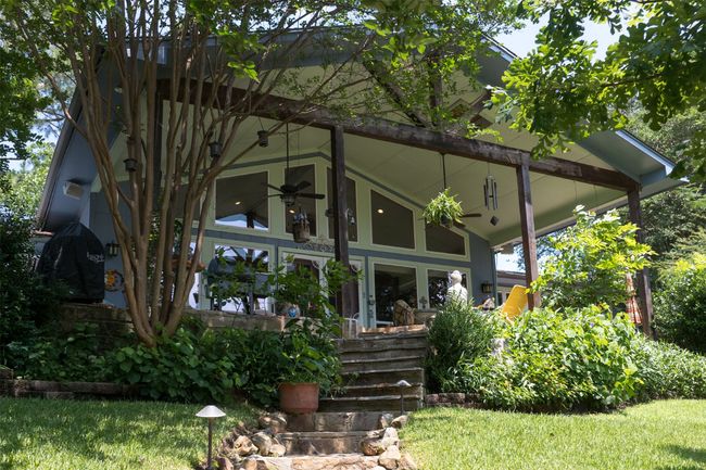 Stone walkway with stairs leading to back porch | Image 33
