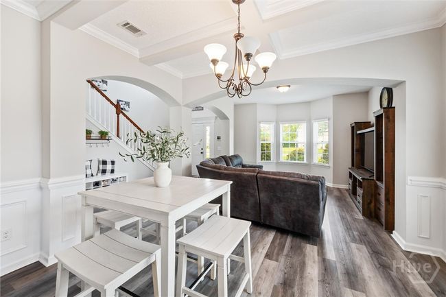 The living room is open to the dining room. | Image 5