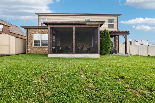 Enjoy outdoor living with a screened-in and covered patio, ideal for relaxing or entertaining.1107 Sycamore Leaf Way Murfreesboro, TN 37129 | Image 37