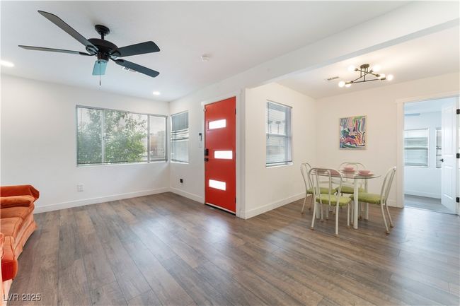 Foyer with baseboards, wood finished floors, and ceiling fan | Image 10