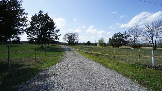 Home off the road tucked back, this is the gated entrance off FM 2029 | Image 30