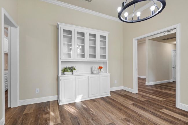 The dining area has double pocket doors to the foyer and built in storage! | Image 5