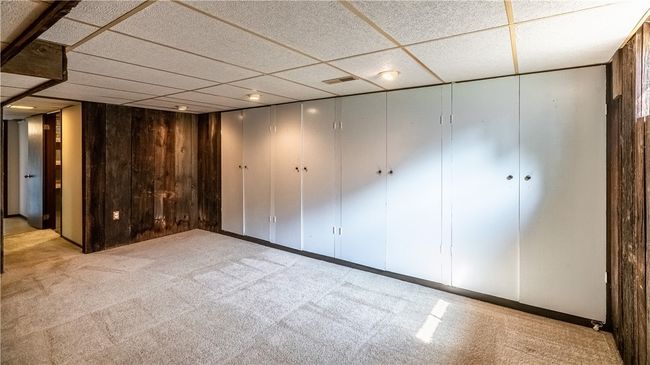 Additional features of the lower level include a half-bath, laundry room, abundant storage, and access to the 1-car garage. | Image 23
