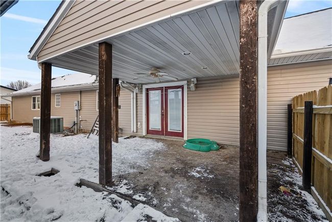 Snow covered patio featuring ceiling fan and central air condition unit | Image 48