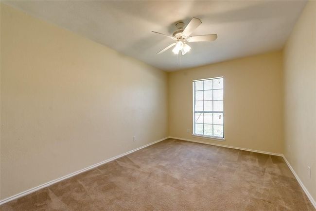 Unfurnished room featuring carpet flooring, a ceiling fan, and baseboards | Image 12