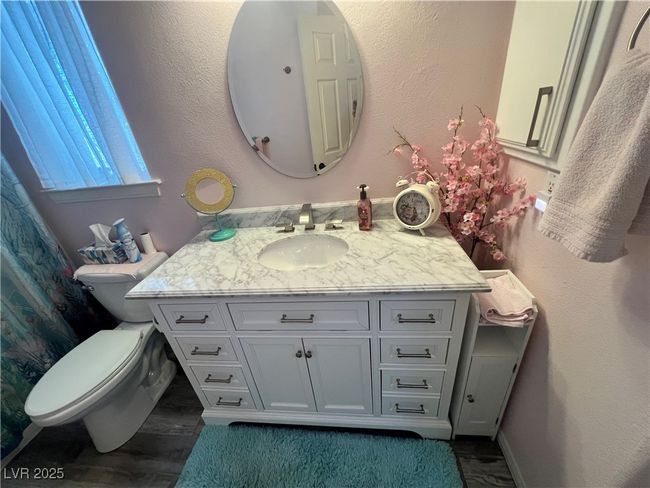 Bathroom with vanity and wood finished floors | Image 53