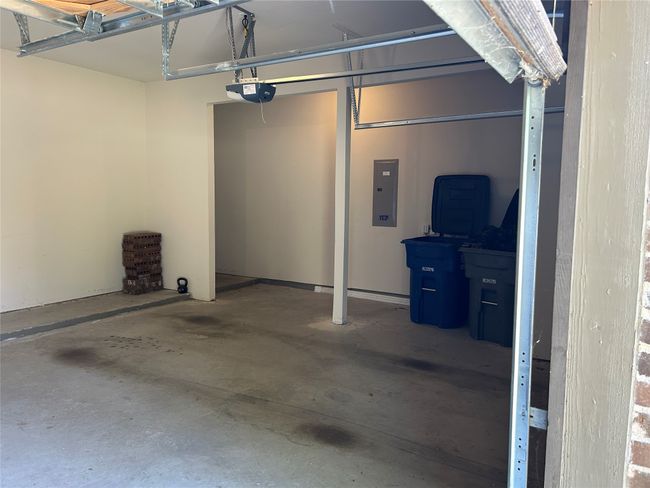 Garage with electric panel and a garage door opener | Image 25